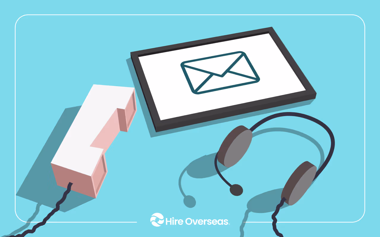 Illustration of a remote customer support workspace on a light teal background. A computer monitor displays an envelope icon representing email, with a headset placed beside it and a white desk phone nearby. The "Hire Overseas" logo appears at the bottom center, suggesting virtual customer service, communication, or outsourced support.