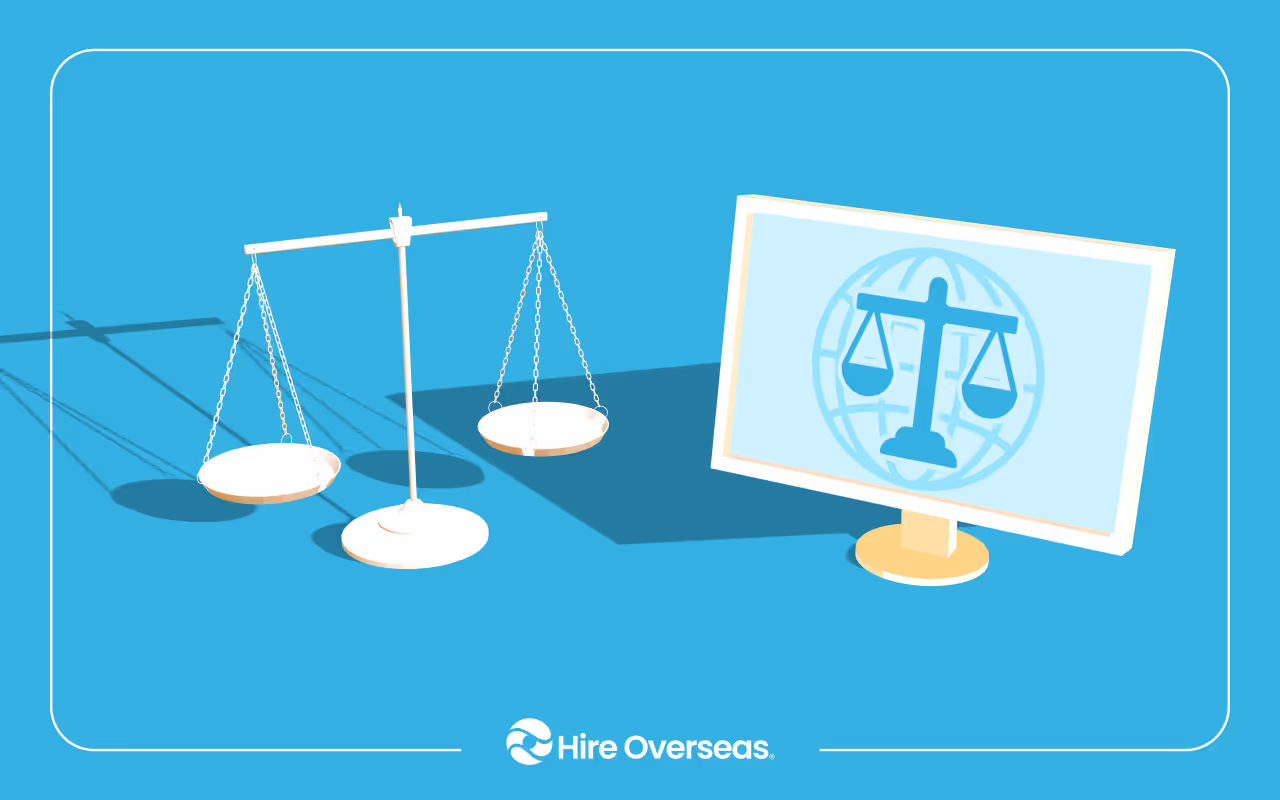 Balanced scales of justice beside a monitor displaying legal scales over a globe